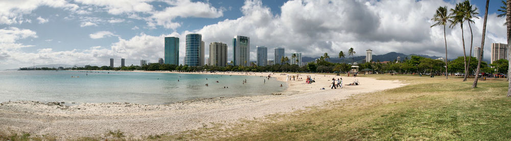 Panoramic view of beach against cloudy sky