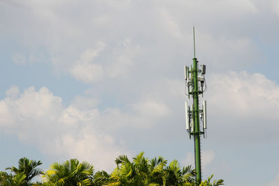 Low angle view of communications tower against sky