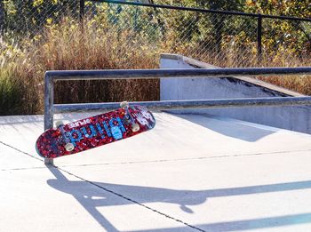 High angle view of skateboard on park during sunny day