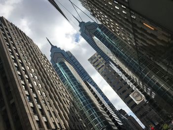 Low angle view of modern buildings against sky