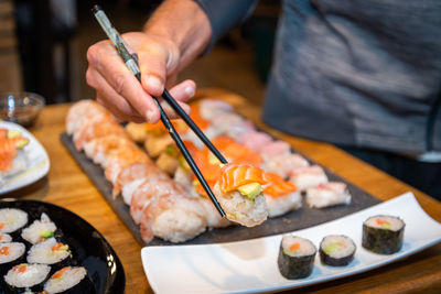 Midsection of man preparing food