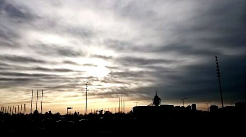 Clouds over city at sunset