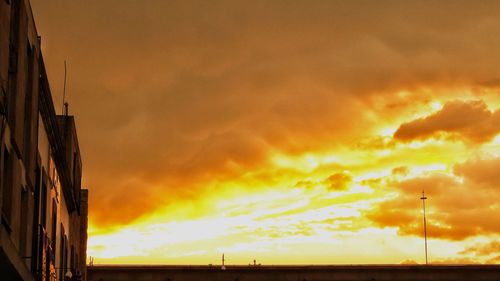 Scenic view of dramatic sky during sunset