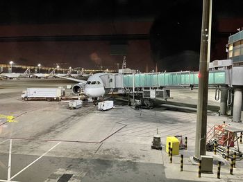 Airplane on airport runway at night