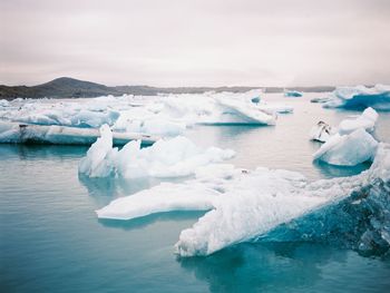 Panoramic shot of frozen sea against sky