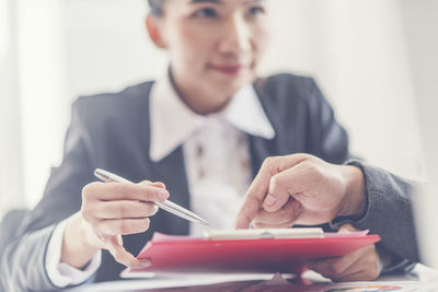 Portrait of woman working on table