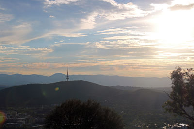 Scenic view of silhouette mountains against sky at sunset