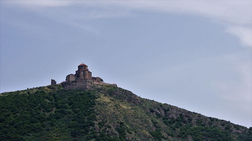 Mountain landscape with orthodox monastery on top