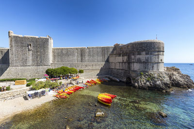 View of historical building against sea