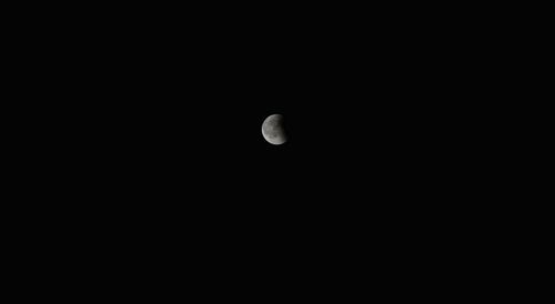 Low angle view of moon in sky at night