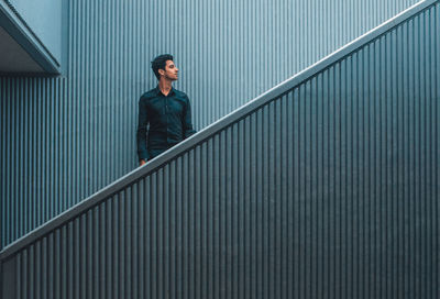 Full length of a young woman on staircase