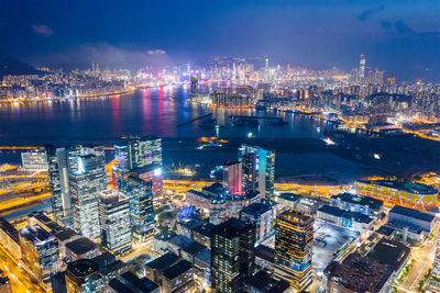 High angle view of illuminated city buildings at night