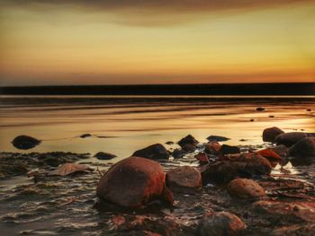 Scenic view of sea at sunset