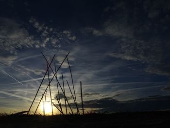 Low angle view of silhouette land against sky during sunset