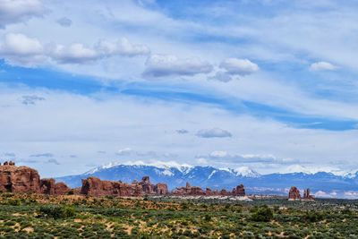 Scenic view of mountains against cloudy sky