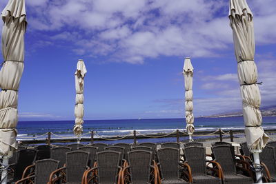 Sailboats in sea against sky