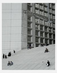 Woman standing in front of building