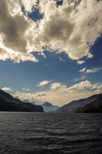 Scenic view of mountains against cloudy sky