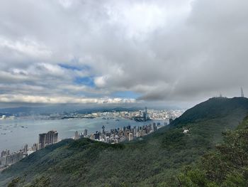 High angle view of townscape by sea against sky