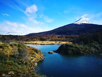 Scenic view of lake against cloudy sky