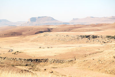 Scenic view of desert against clear sky
