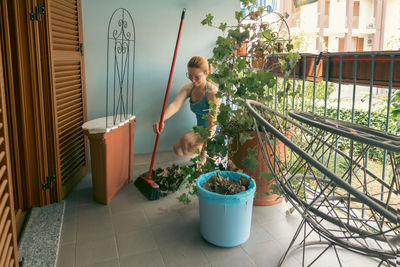 High angle view of man gardening in greenhouse