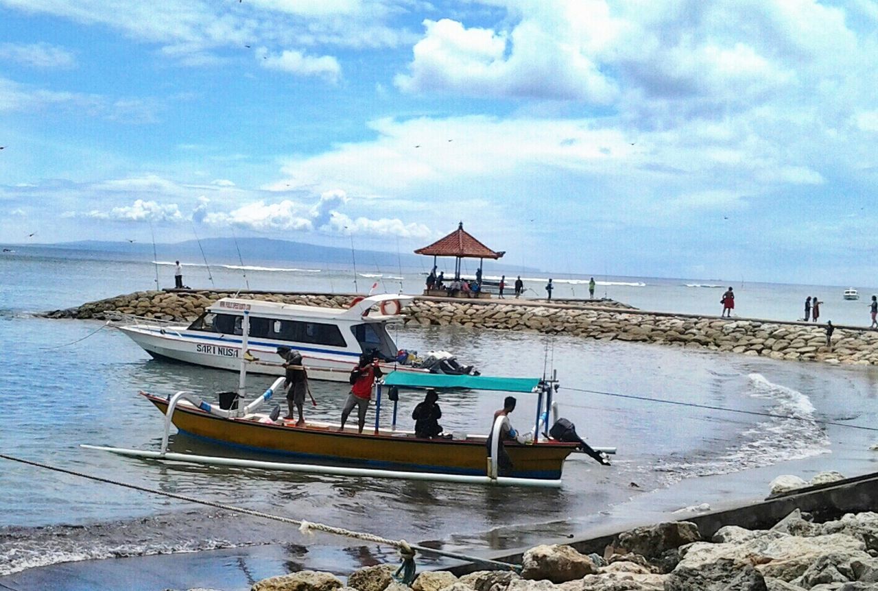 sea, water, horizon over water, beach, sky, shore, leisure activity, lifestyles, vacations, cloud - sky, men, sand, tranquil scene, person, nautical vessel, tranquility, scenics, nature, beauty in nature