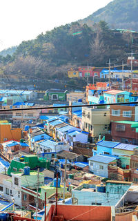 High angle view of buildings and mountain against sky