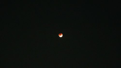 Low angle view of moon against sky at night