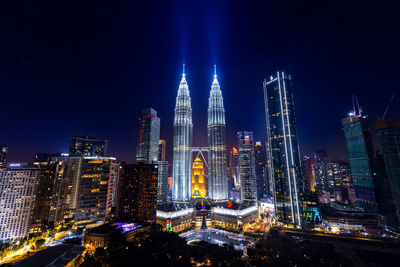 Illuminated buildings in city at night