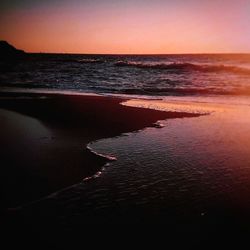 Scenic view of sea against sky at sunset