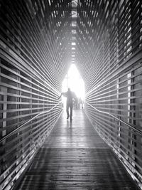 Man walking on footbridge