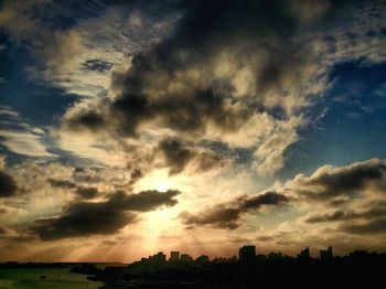 Scenic view of landscape against cloudy sky