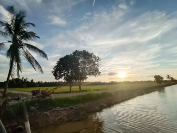 Scenic view of lake against sky during sunset