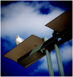 High section of building against blue sky