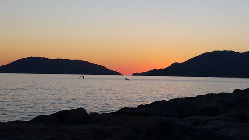 View of calm sea at sunset