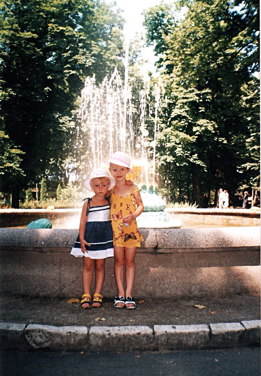 full length, two people, togetherness, child, portrait, senior adult, looking at camera, childhood, bonding, young adult, senior women, cheerful, women, adult, females, outdoors, people, young women, summer, friendship, leisure activity, pre-adolescent child, young at heart, smiling, day, tree, nature, cowboy hat