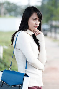 Young woman standing at park