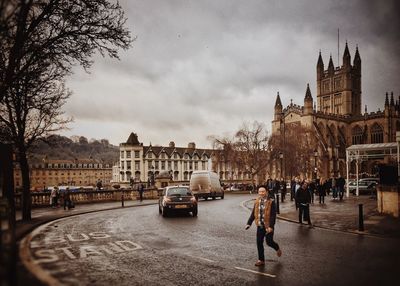 People walking on street in city