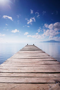 Pier over sea against sky