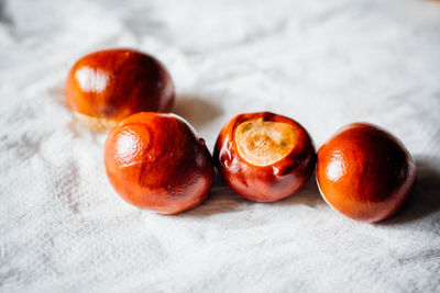 Close-up of horse chestnut seeds on table