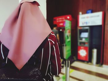Close-up of woman wearing headscarf at store