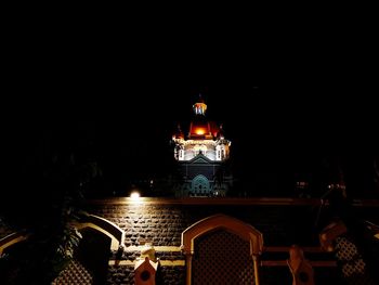 Illuminated buildings in city at night