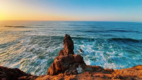 Scenic view of sea against sky during sunset