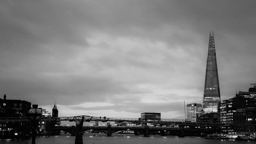 Cityscape against cloudy sky