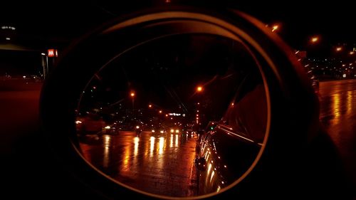 Close-up of illuminated car on street at night