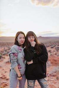 Sisters during the golden hour in monument valley.