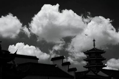 Low angle view of buildings in city against sky