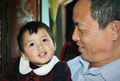 Close-up father with daughter at home