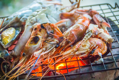 Close-up of meat on barbecue grill